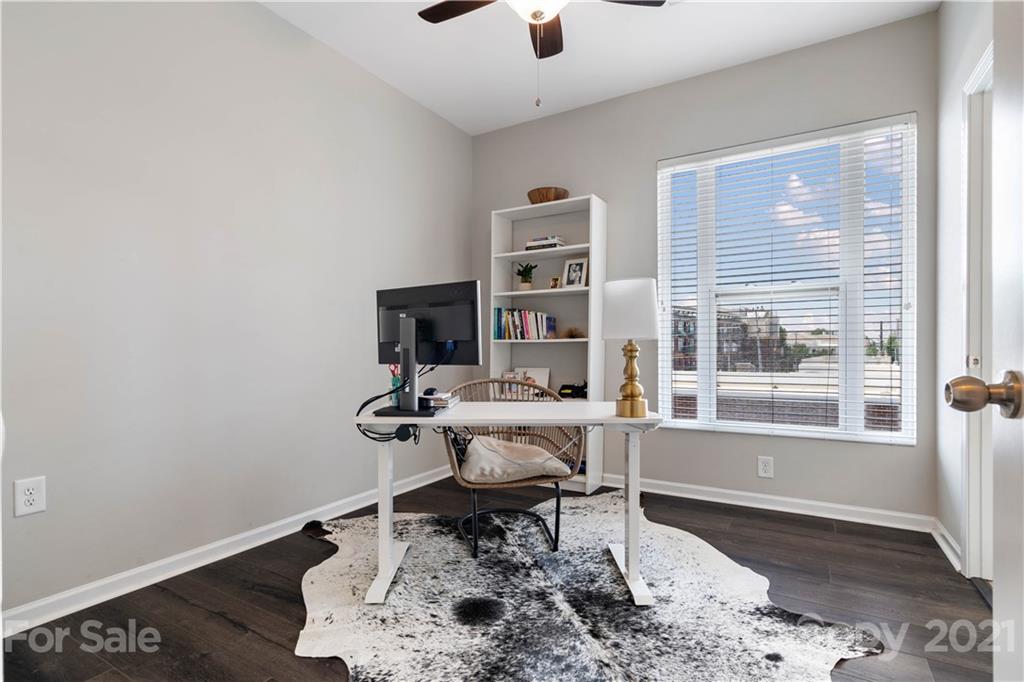 1433 Camden Road Charlotte, NC 28203 - Photo 14 of 22 a living room with furniture a rug and a window