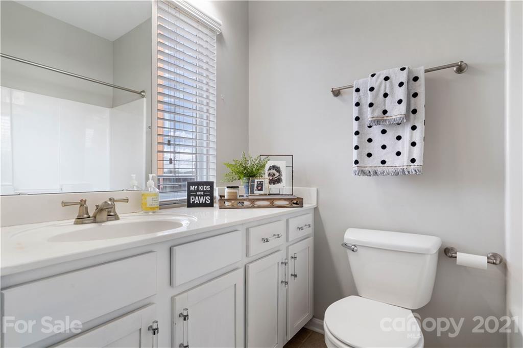 1433 Camden Road Charlotte, NC 28203 - Photo 15 of 22 a bathroom with a sink a toilet and a mirror