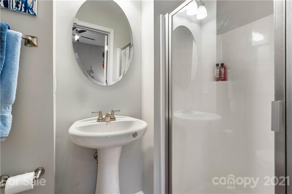 1433 Camden Road Charlotte, NC 28203 - Photo 17 of 22 a bathroom with a sink and a mirror