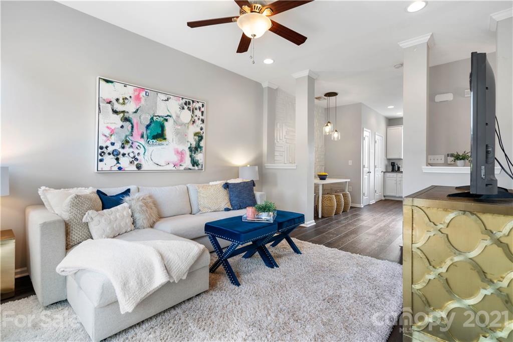 1433 Camden Road Charlotte, NC 28203 - Photo 3 of 22 a living room with furniture and a chandelier
