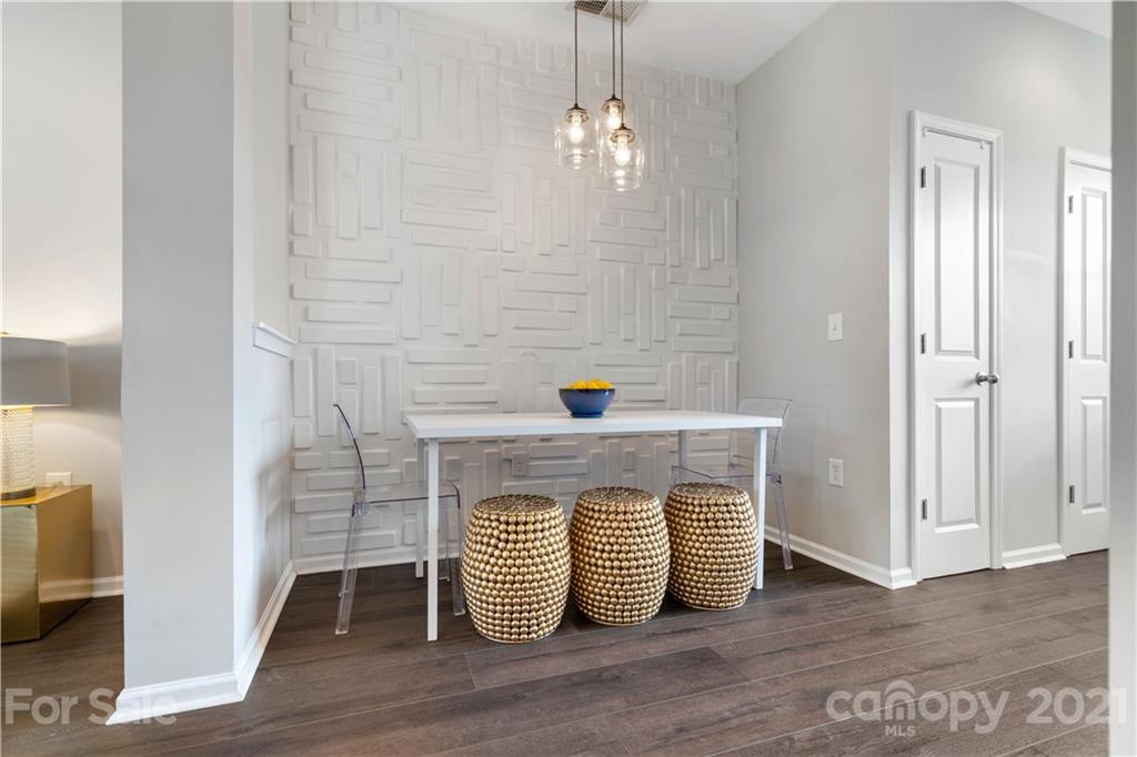 1433 Camden Road Charlotte, NC 28203 - Photo 5 of 22 a view of empty room with wooden floor and fan