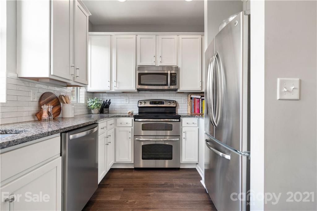 1433 Camden Road Charlotte, NC 28203 - Photo 7 of 22 a kitchen with cabinets stainless steel appliances and a sink