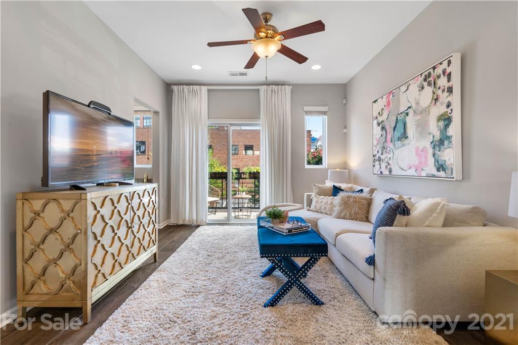 1433 Camden Road Charlotte, NC 28203 - Photo 8 of 22 a living room with furniture and a flat screen tv
