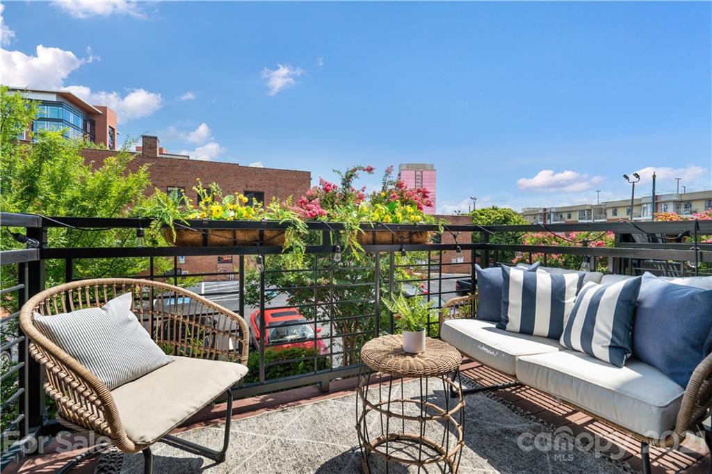 1433 Camden Road Charlotte, NC 28203 - Photo 10 of 22 a view of a chairs in wooden deck