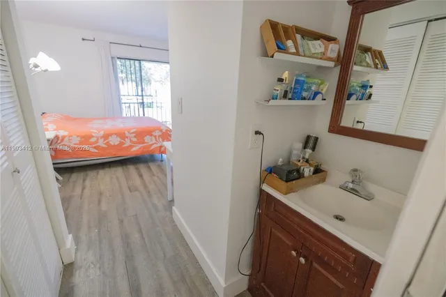 a bathroom with a sink and a mirror