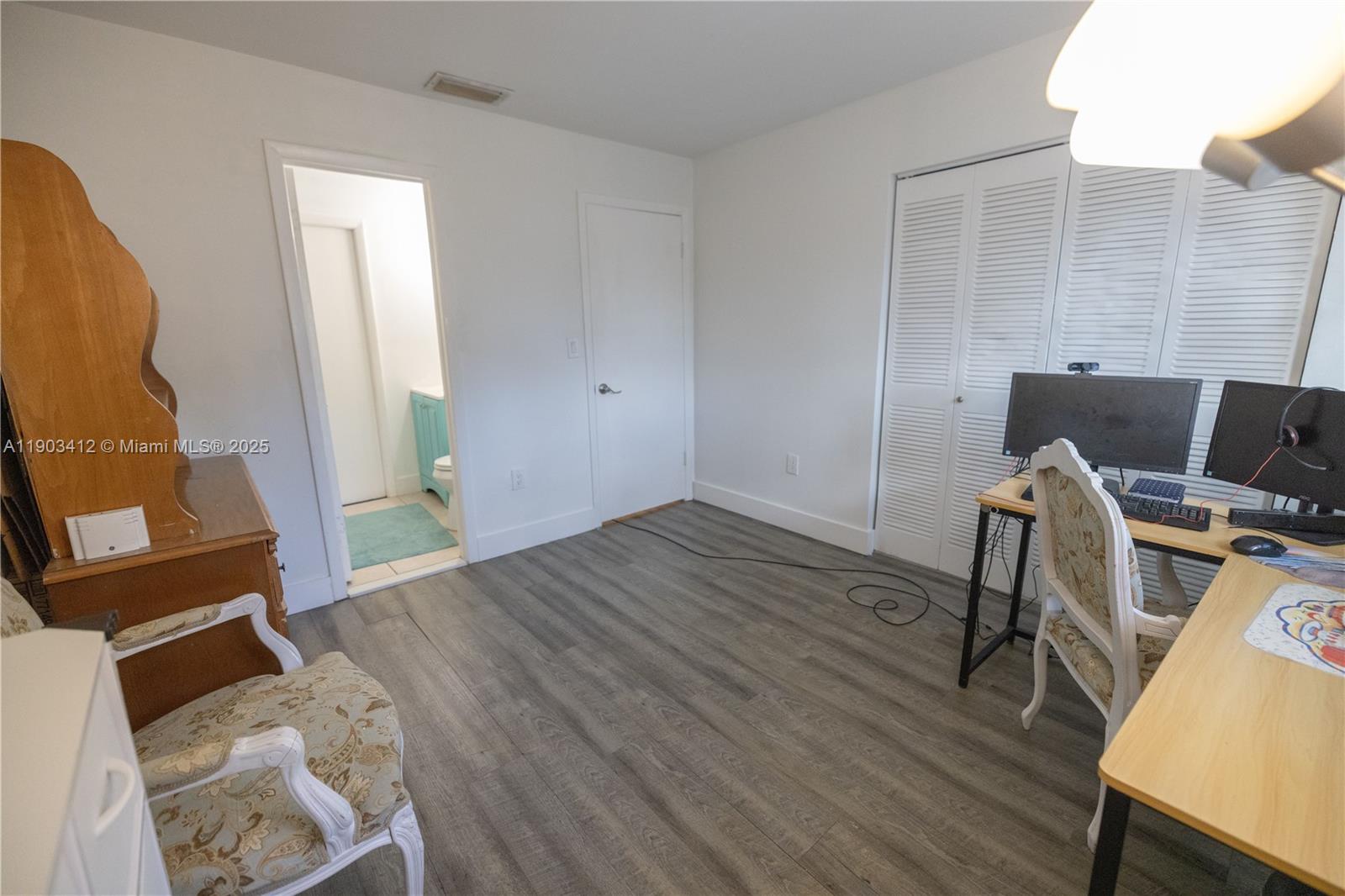 12955 Southwest 66th Lane, Unit 2092 Miami, FL 33183 - Photo 25 of 46 a view of room with wooden floor and furniture