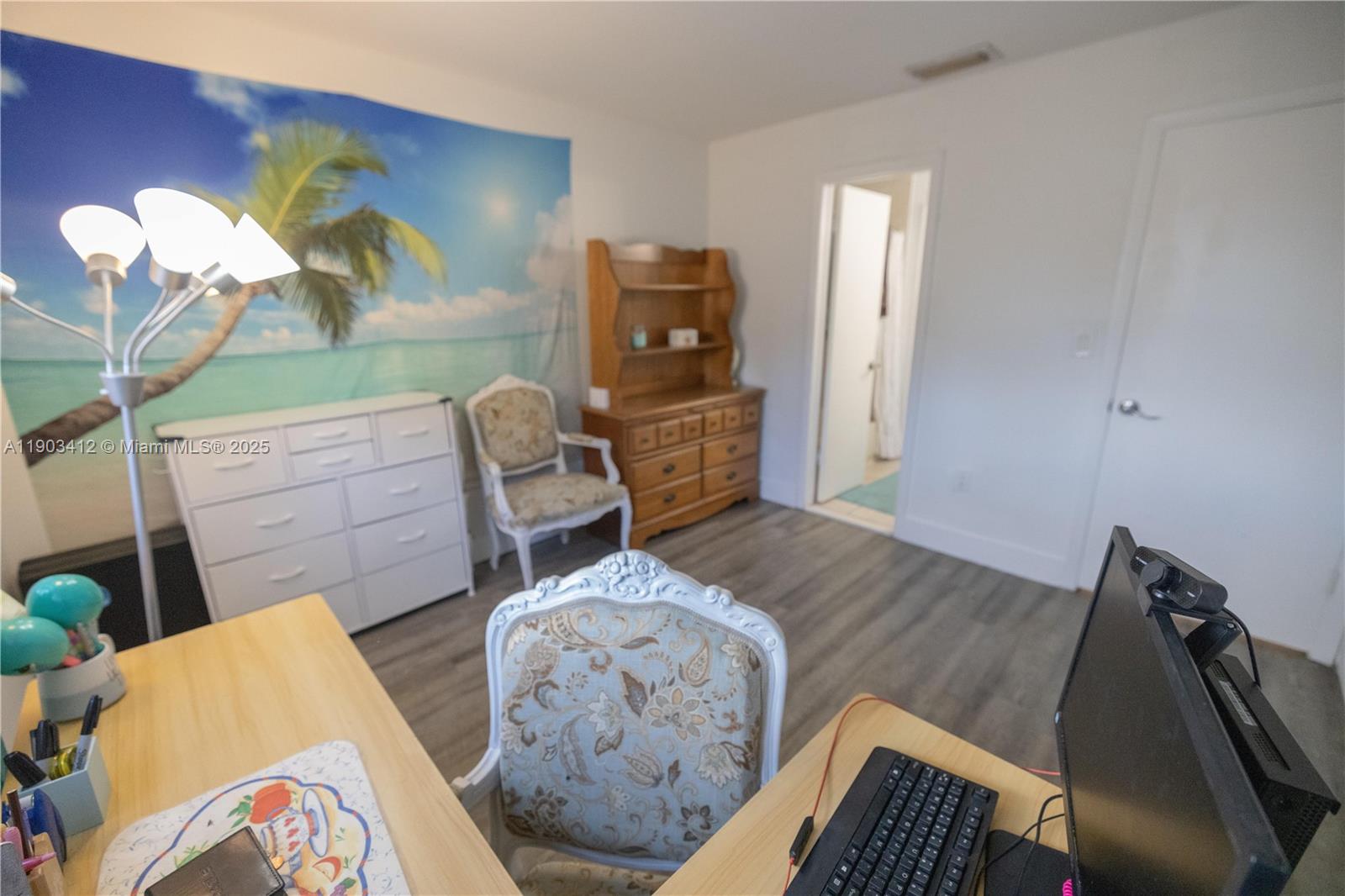 12955 Southwest 66th Lane, Unit 2092 Miami, FL 33183 - Photo 26 of 46 a living room with furniture and wooden floor