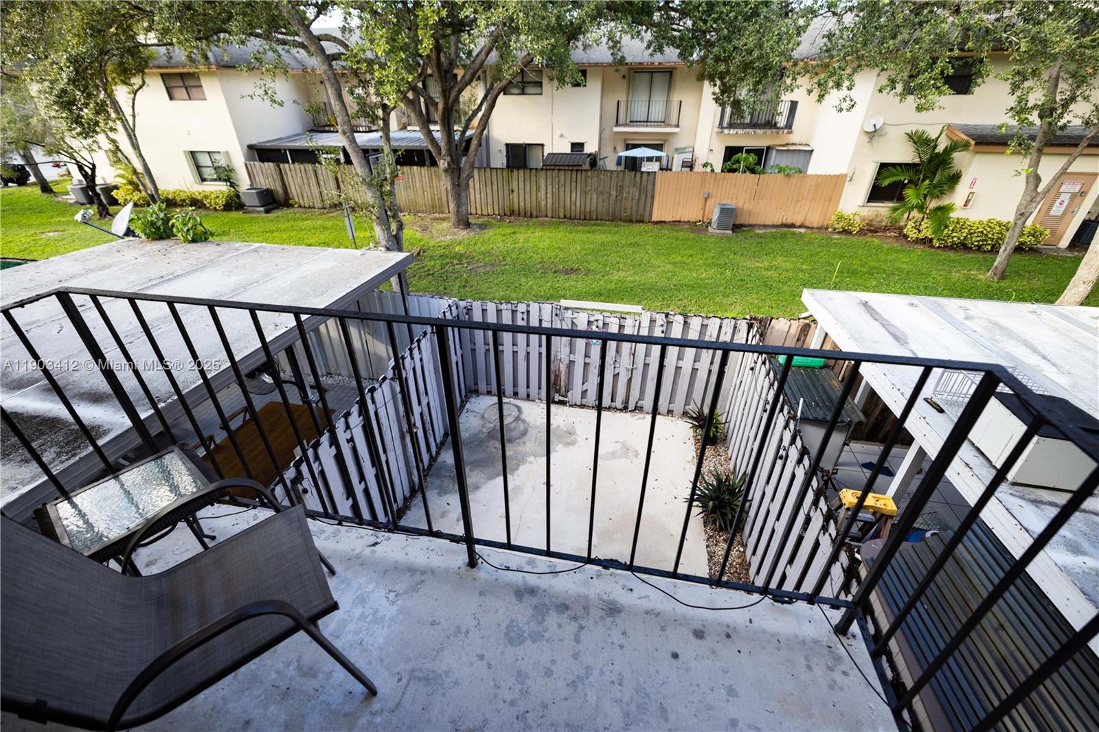 12955 Southwest 66th Lane, Unit 2092 Miami, FL 33183 - Photo 3 of 46 a view of a patio with a yard