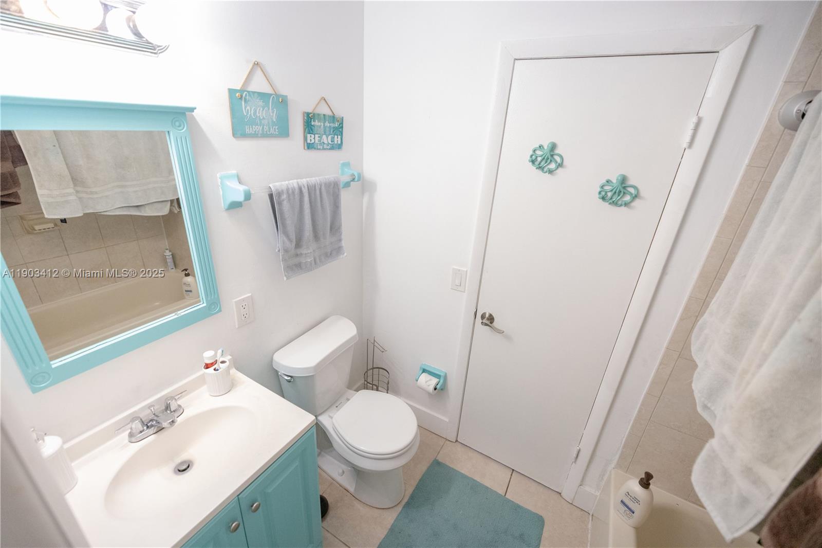 12955 Southwest 66th Lane, Unit 2092 Miami, FL 33183 - Photo 34 of 46 a white toilet sitting next to a bathroom sink