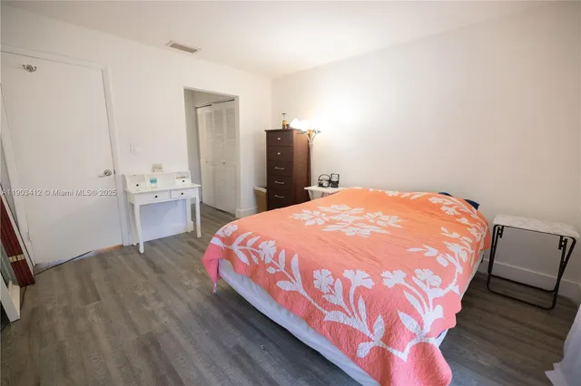 a bathroom with a shower and a sink