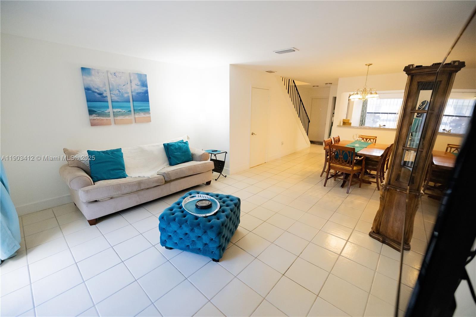 12955 Southwest 66th Lane, Unit 2092 Miami, FL 33183 - Photo 43 of 46 a living room with furniture and a flat screen tv