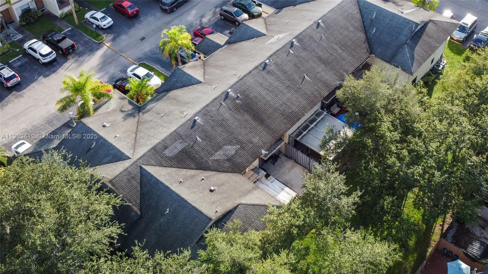 12955 Southwest 66th Lane, Unit 2092 Miami, FL 33183 - Photo 6 of 46 an aerial view of a house with a yard