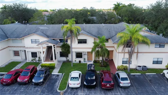 a white toilet sitting next to a sink