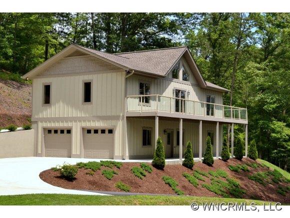 230 Porters Ridge Canton, NC 28716 - Photo 1 of 21 a view of a yard in front of a house with large windows