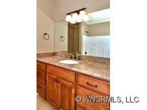230 Porters Ridge Canton, NC 28716 - Photo 12 of 21 a bathroom with a sink and a mirror
