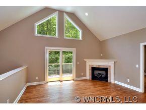 230 Porters Ridge Canton, NC 28716 - Photo 3 of 21 an empty room with windows and fireplace