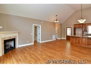 230 Porters Ridge Canton, NC 28716 - Photo 4 of 21 a view of an empty room with chandelier and fireplace