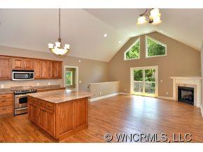 230 Porters Ridge Canton, NC 28716 - Photo 5 of 21 a kitchen with kitchen island granite countertop a sink cabinets and stainless steel appliances