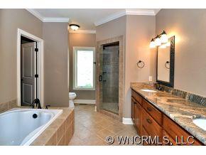 230 Porters Ridge Canton, NC 28716 - Photo 9 of 21 a bathroom with a granite countertop tub sink and mirror