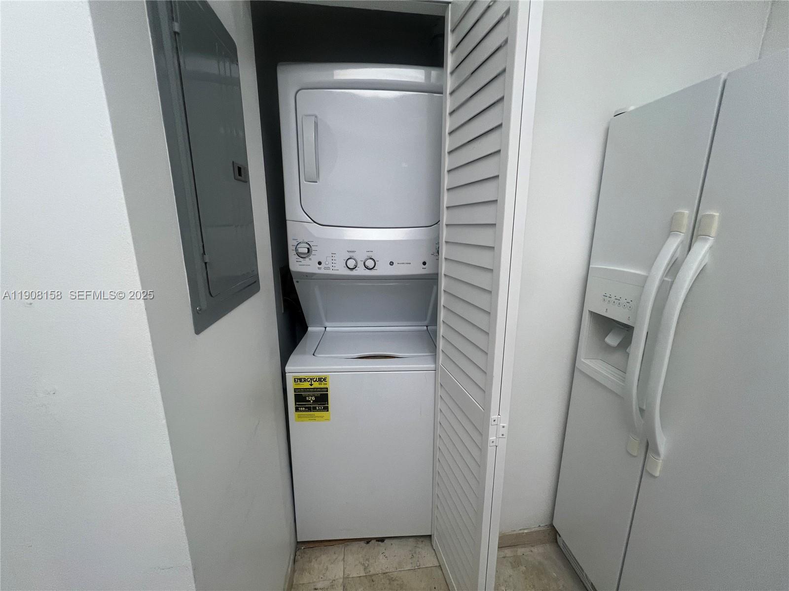 888 Brickell Key Drive, Unit 806 Miami, FL 33131 - Photo 15 of 20 a utility room with dryer and washer