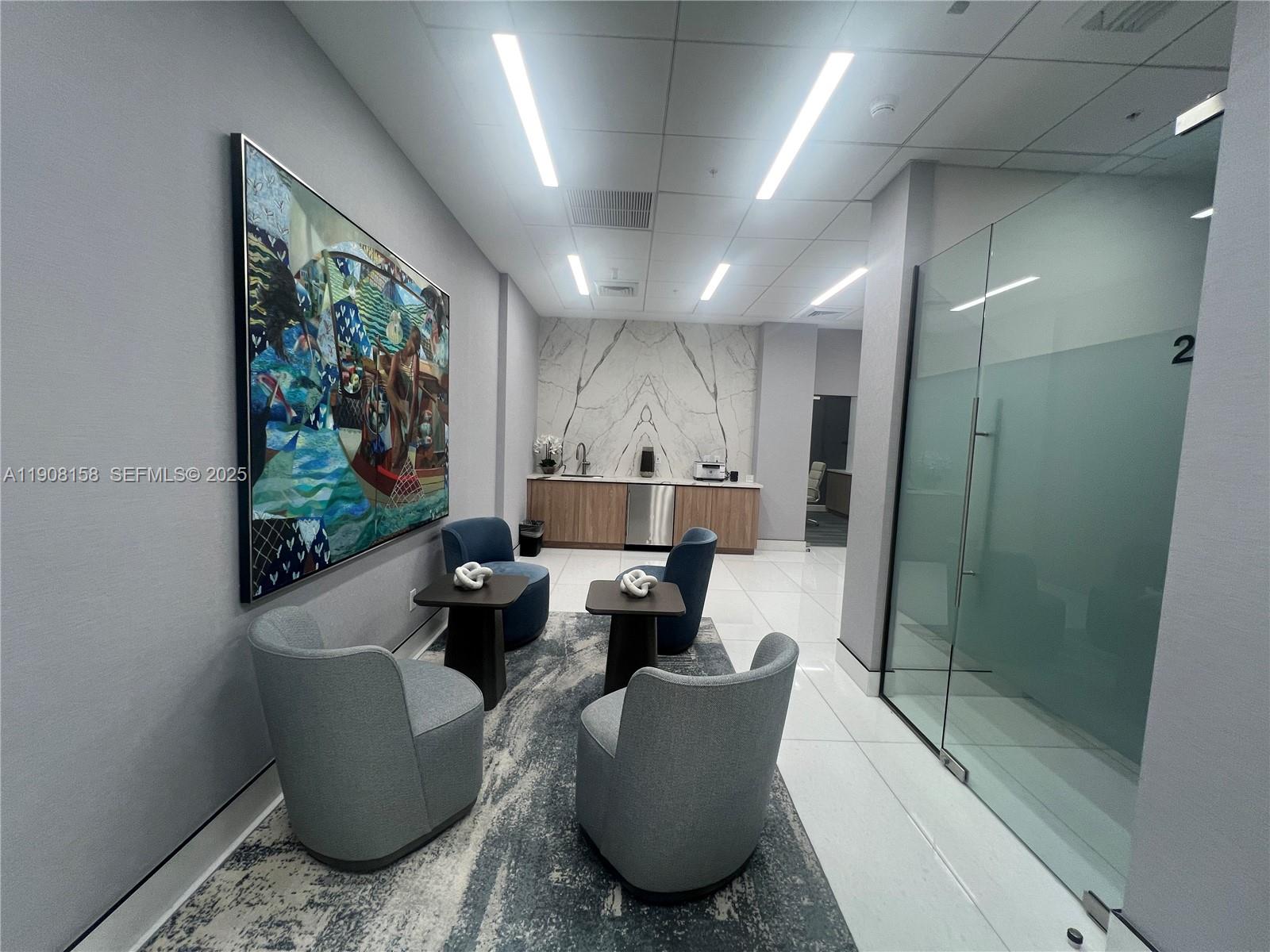 888 Brickell Key Drive, Unit 806 Miami, FL 33131 - Photo 20 of 20 a living room with furniture and a large window