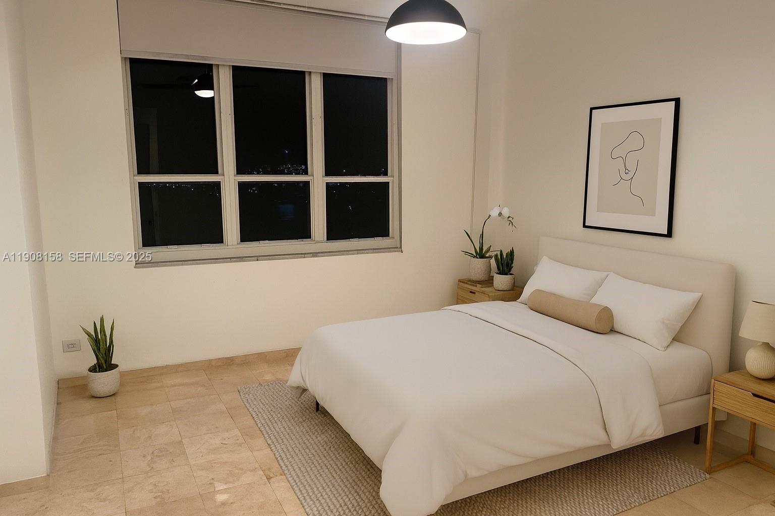 888 Brickell Key Drive, Unit 806 Miami, FL 33131 - Photo 6 of 20 a bedroom with a bed and a window