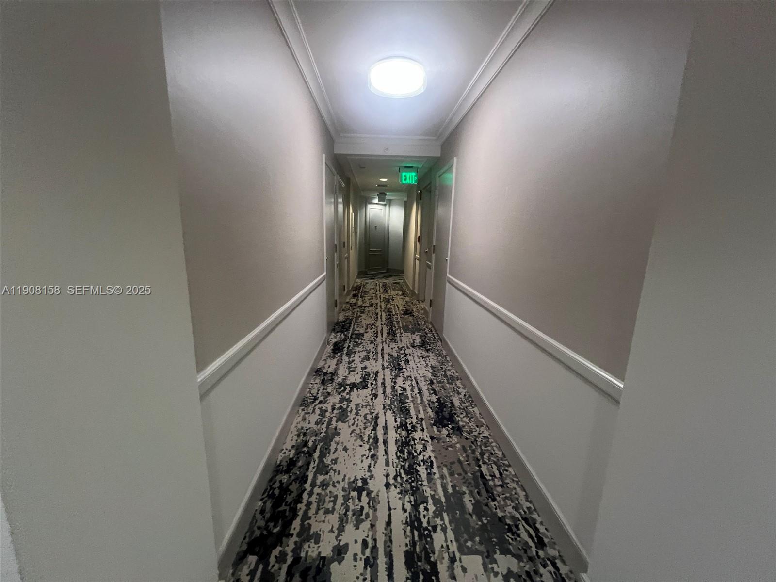 888 Brickell Key Drive, Unit 806 Miami, FL 33131 - Photo 10 of 20 wooden floor with staircase