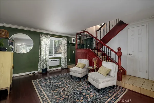 a living room with furniture and a rug