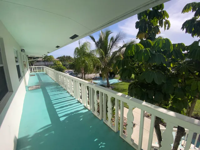 a view of balcony with wooden floor