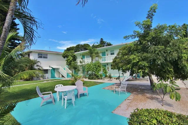 a view of a chairs and table in the garden