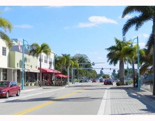 a view of street with cars parked