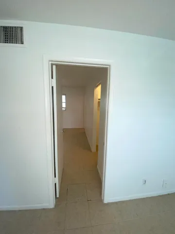 a view of a room with a hallway