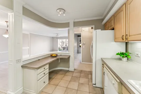 a kitchen with a sink a stove and a refrigerator