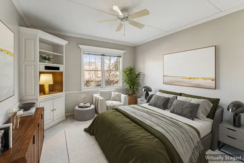 a bedroom with a bed and glass windows