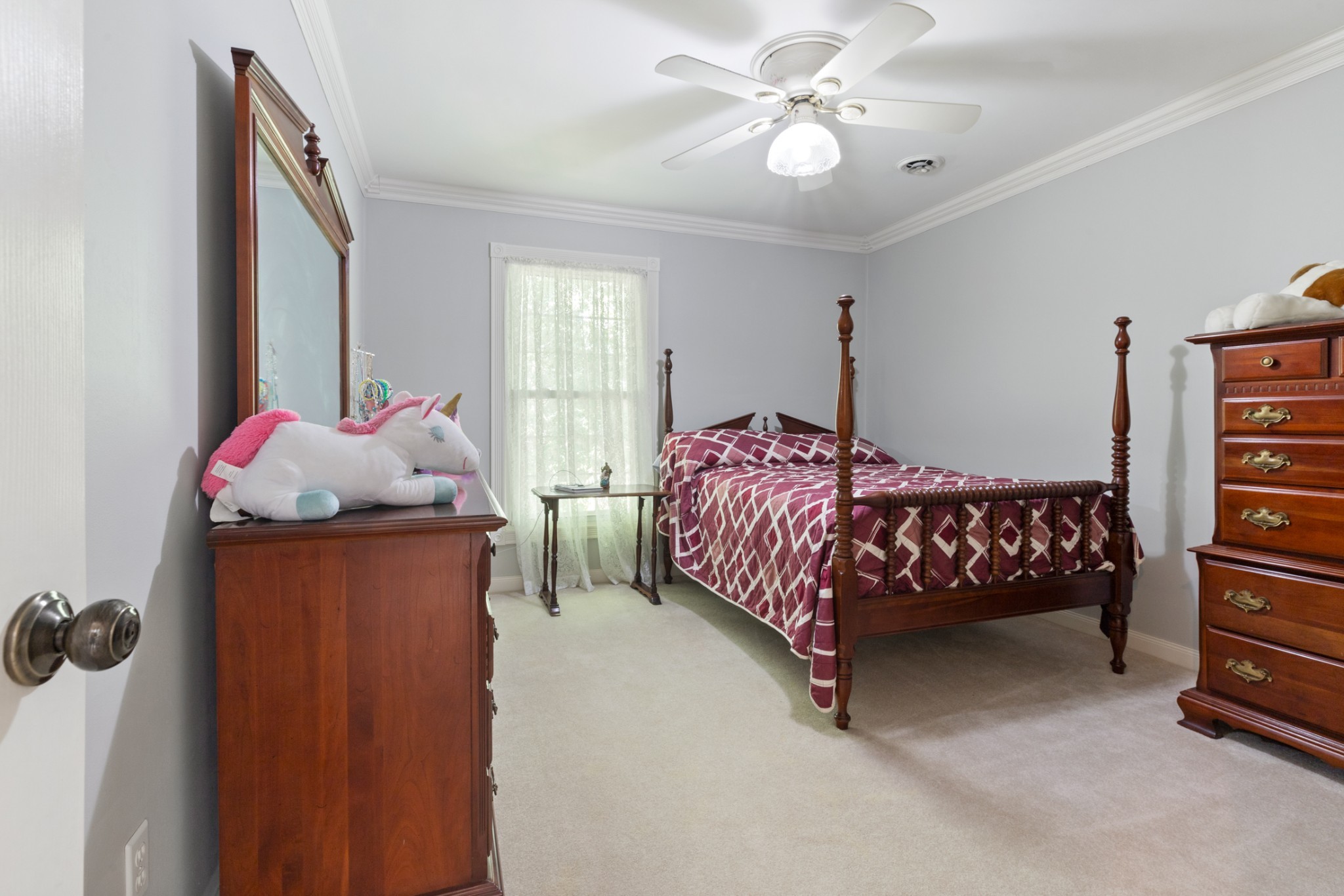 7422 Indian Creek Road McEwen, TN 37101 - Photo 36 of 86 a bedroom with a bed and a chandelier