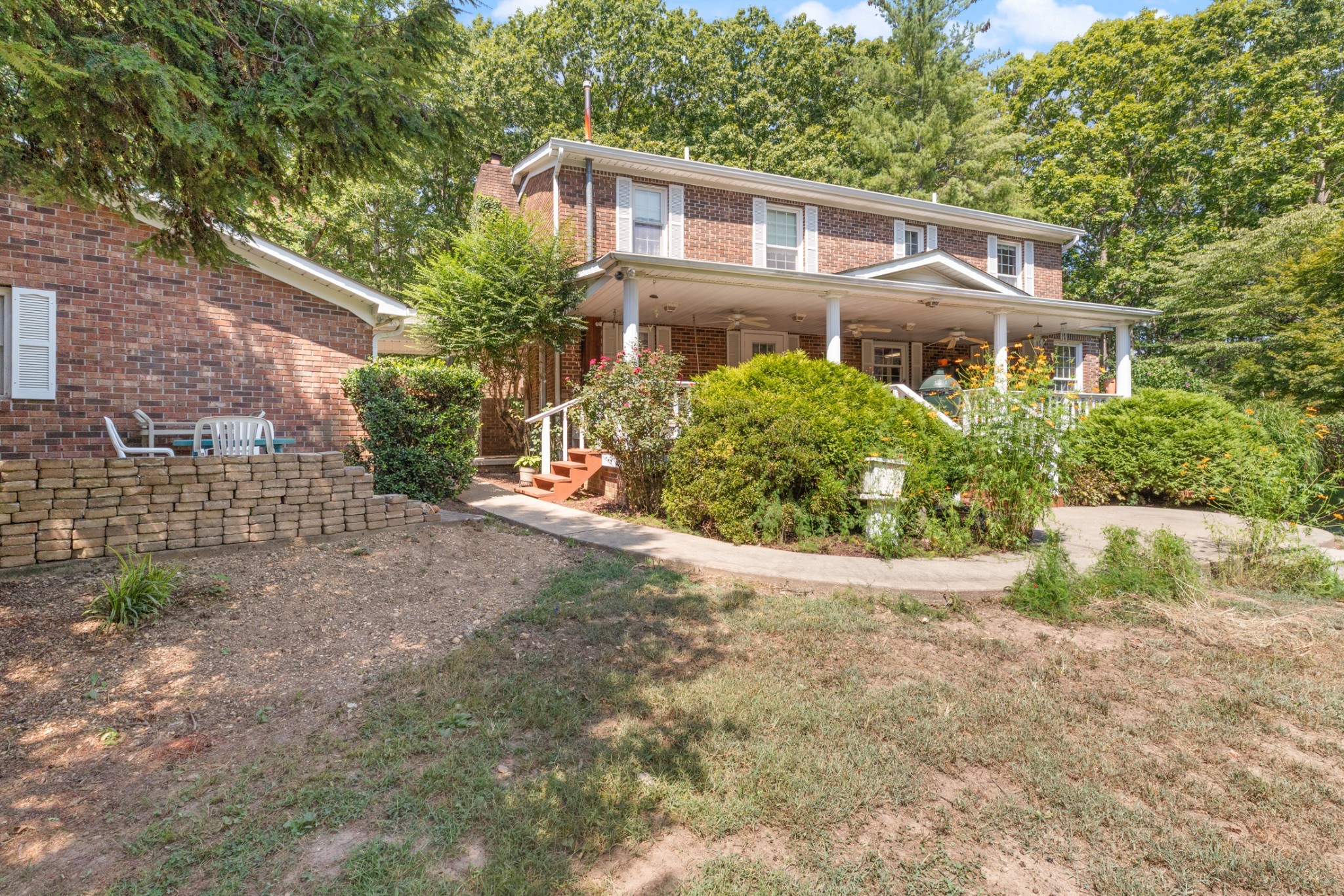 7422 Indian Creek Road McEwen, TN 37101 - Photo 55 of 86 a front view of a house with a yard and potted plants