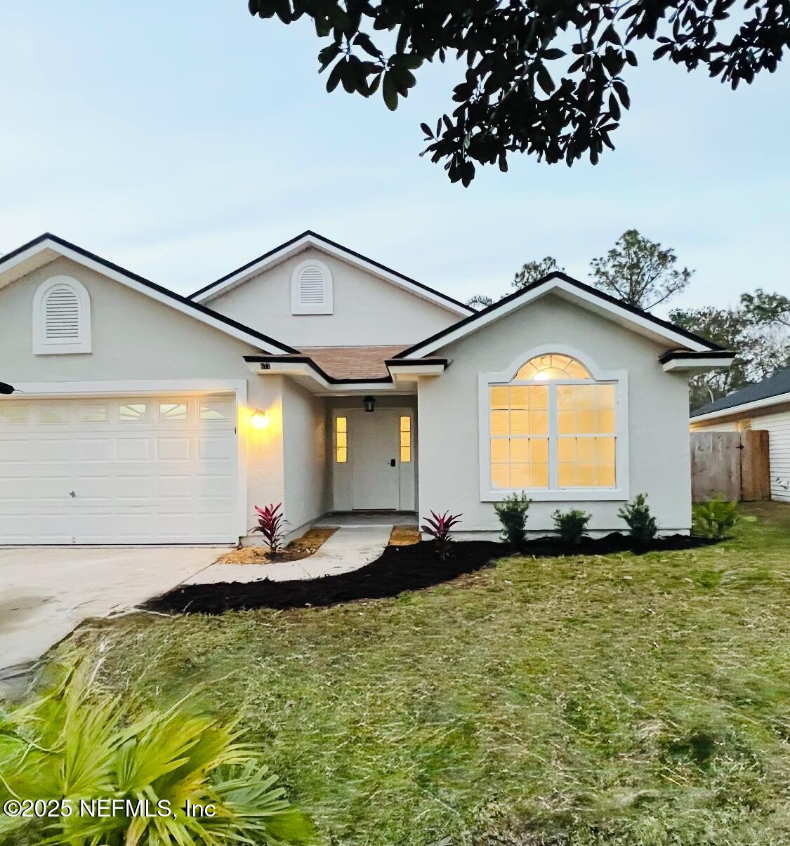 677 MacKenzie Circle St. Augustine, FL 32092 - Photo 2 of 92 a front view of a house with a yard