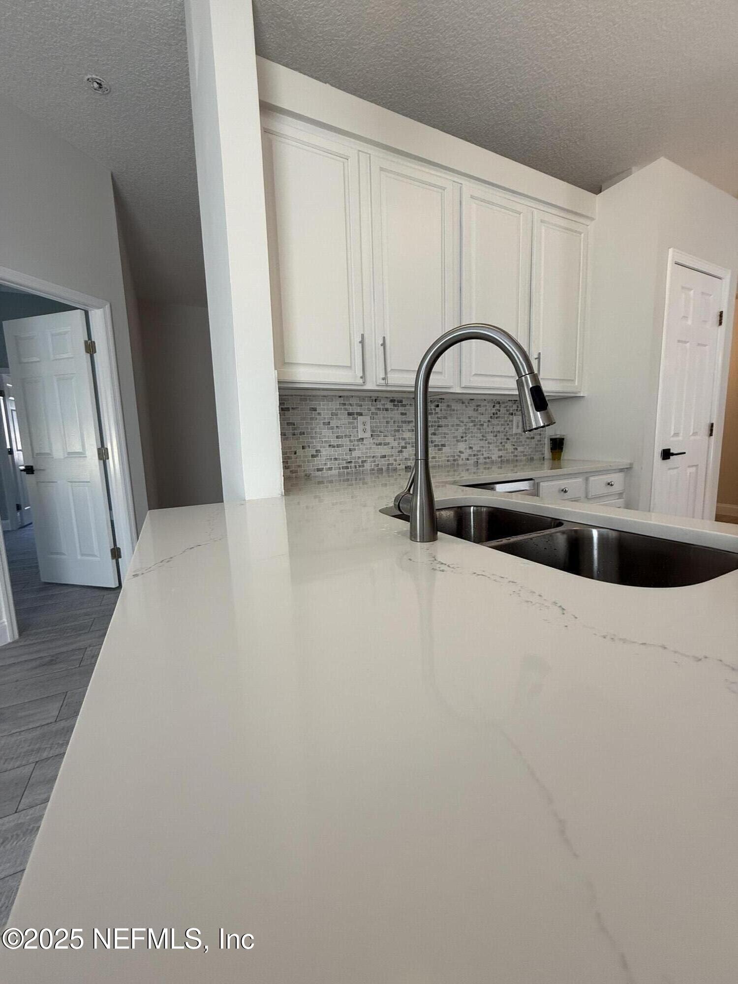 677 MacKenzie Circle St. Augustine, FL 32092 - Photo 21 of 92 a close view of a sink and dishwasher in a kitchen