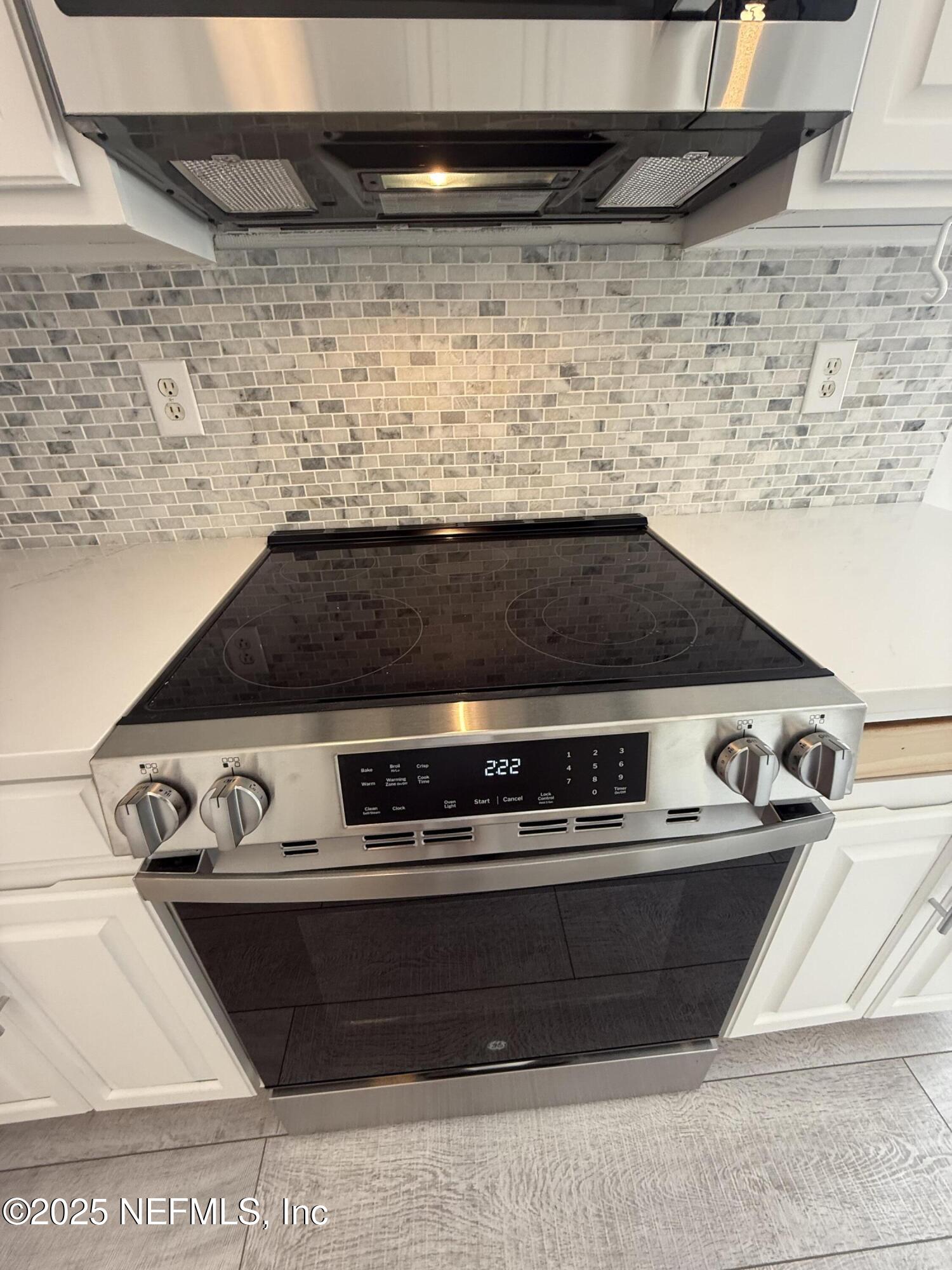 677 MacKenzie Circle St. Augustine, FL 32092 - Photo 26 of 92 a close view of stove top oven
