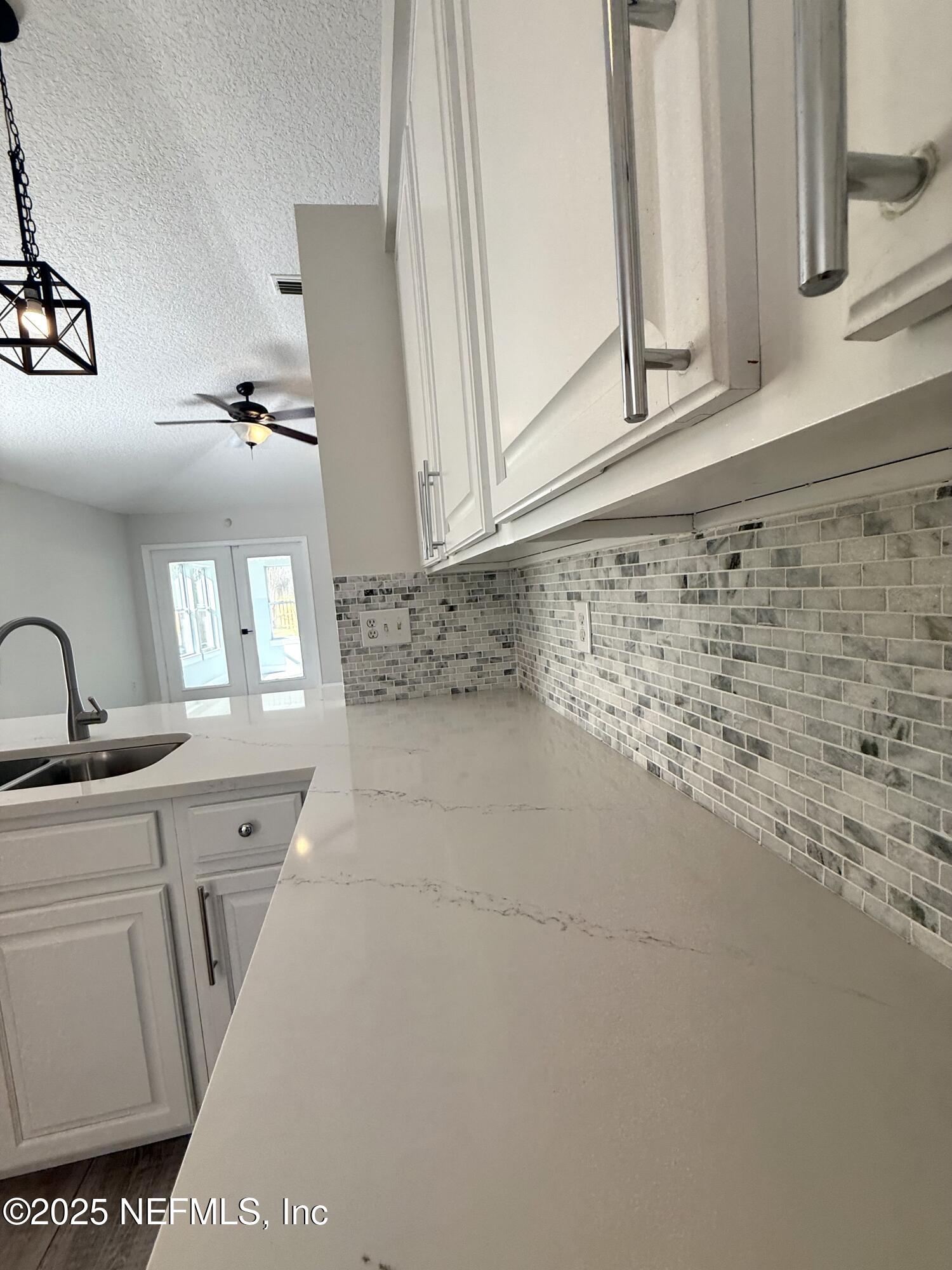 677 MacKenzie Circle St. Augustine, FL 32092 - Photo 32 of 92 a view of a kitchen with sink and washing machine
