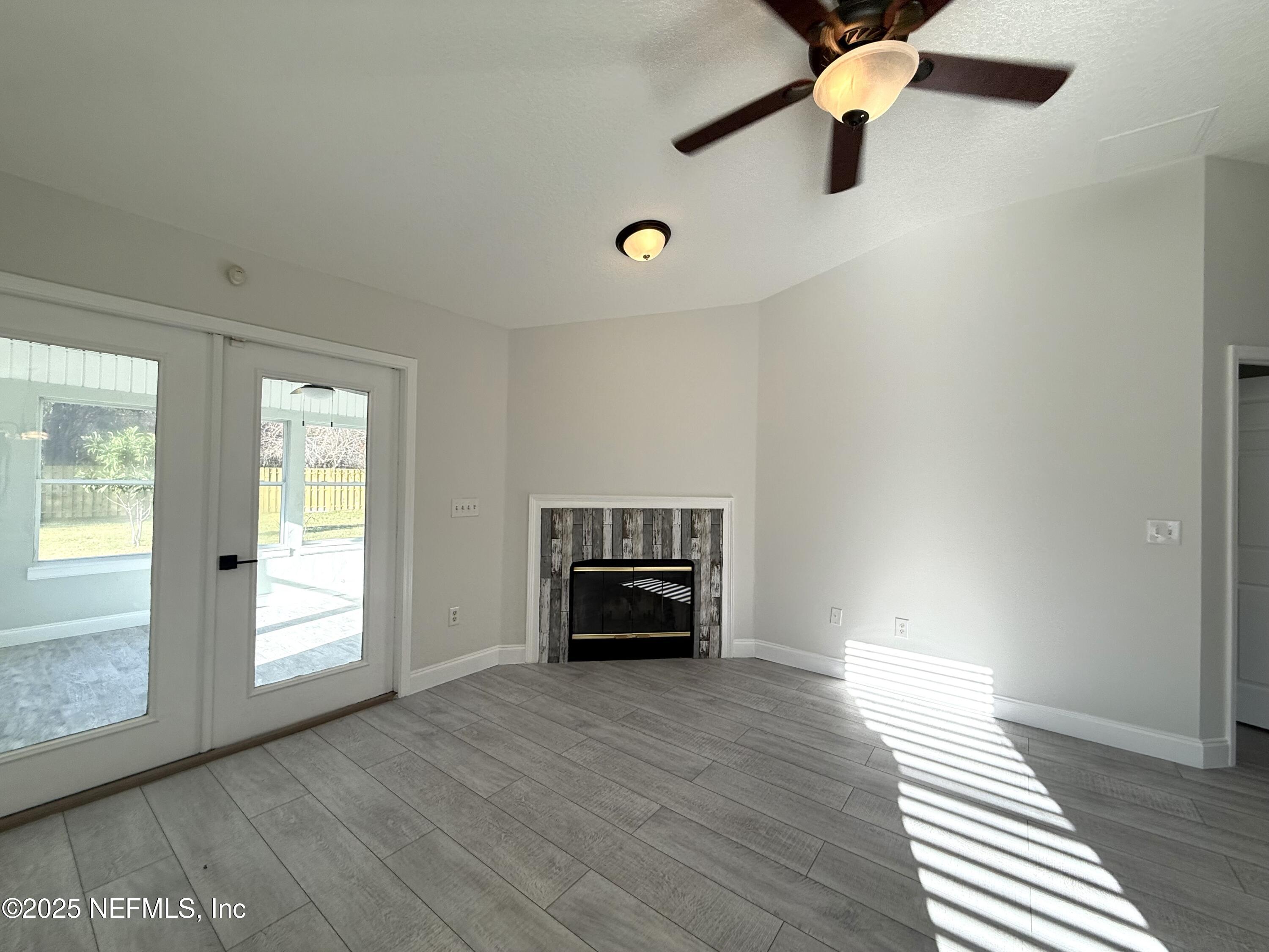 677 MacKenzie Circle St. Augustine, FL 32092 - Photo 37 of 92 an empty room with windows and cabinet