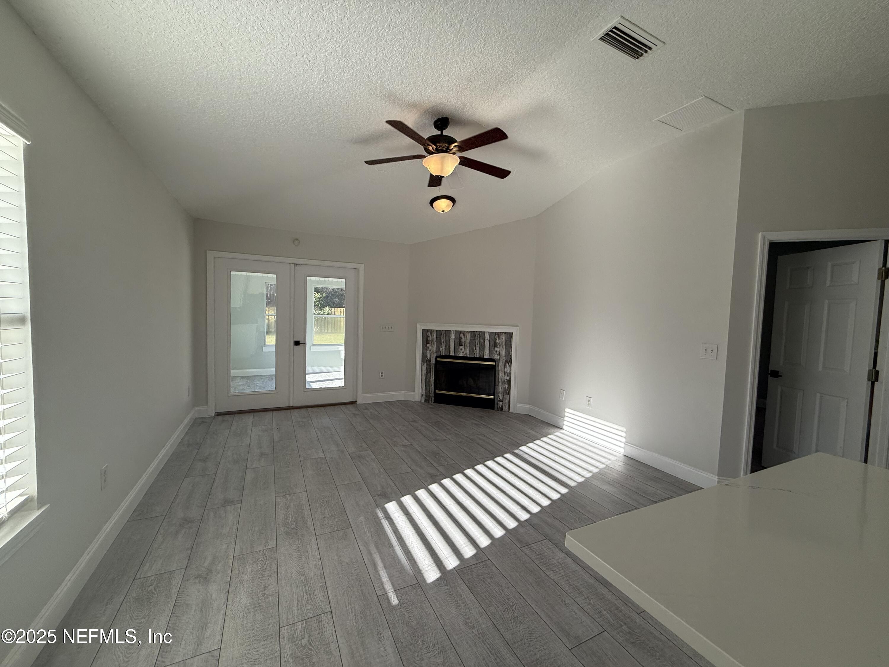 677 MacKenzie Circle St. Augustine, FL 32092 - Photo 38 of 92 a view of livingroom with hardwood floor and a ceiling fan