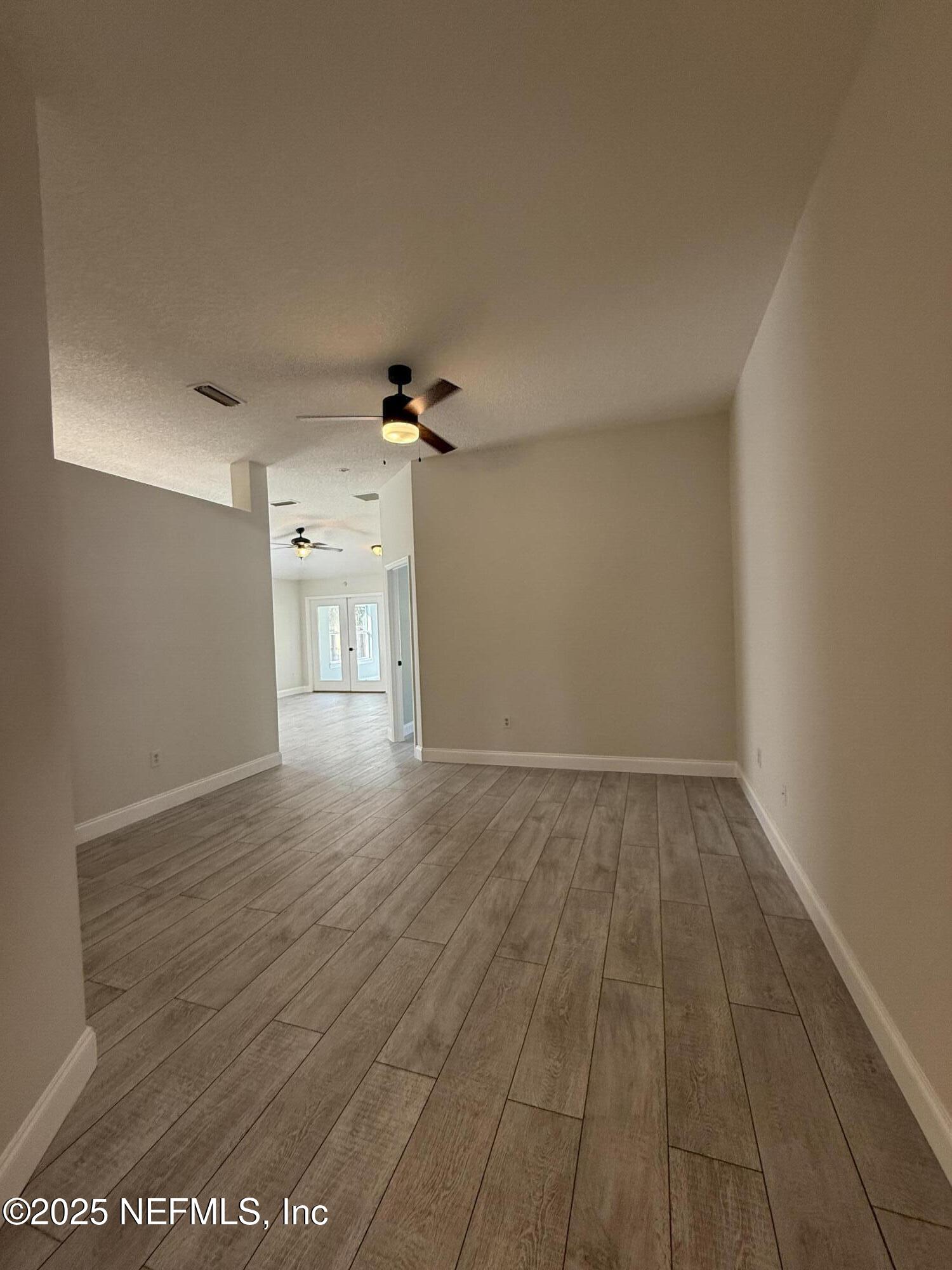 677 MacKenzie Circle St. Augustine, FL 32092 - Photo 39 of 92 wooden floor in an empty room