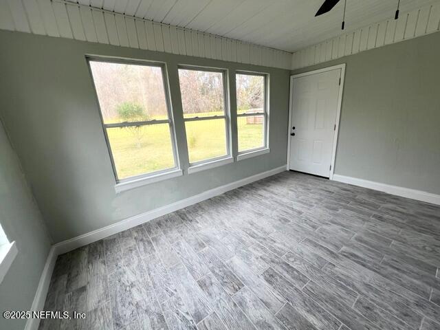 677 MacKenzie Circle St. Augustine, FL 32092 - Photo 67 of 92 an empty room with wooden floor and windows