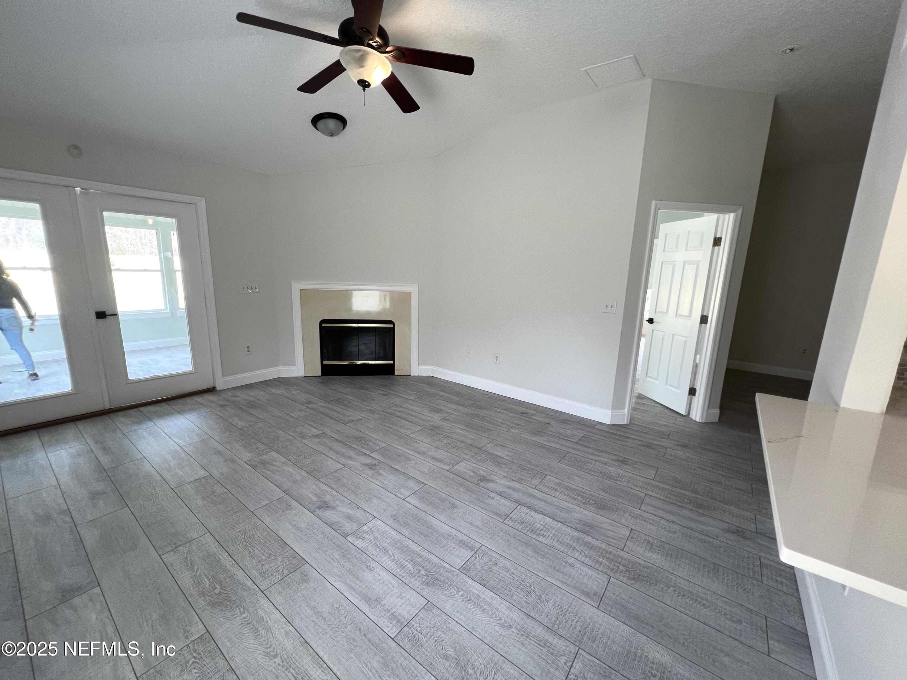 677 MacKenzie Circle St. Augustine, FL 32092 - Photo 70 of 92 wooden floor in an empty room with a window