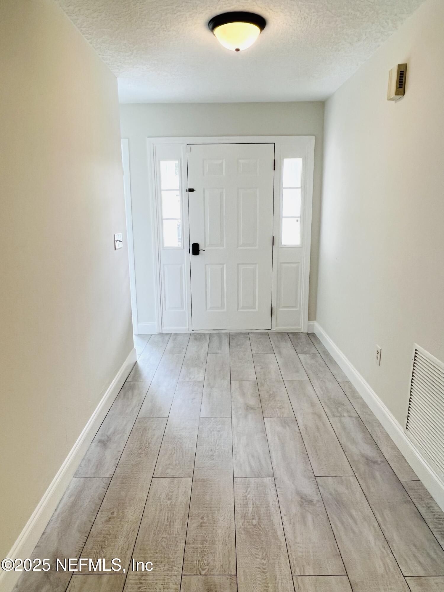 677 MacKenzie Circle St. Augustine, FL 32092 - Photo 75 of 92 a view of a livingroom with wooden floor