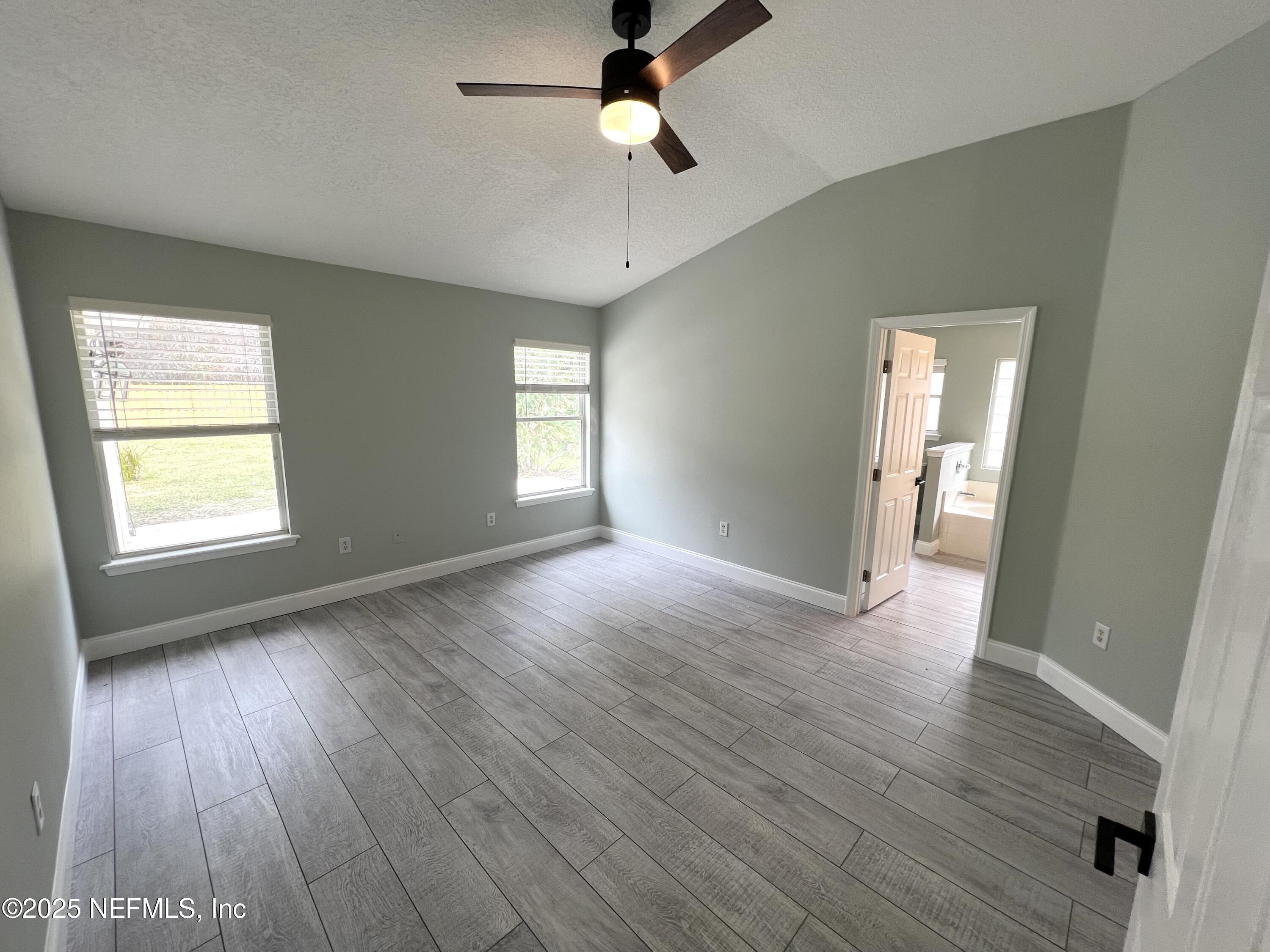 677 MacKenzie Circle St. Augustine, FL 32092 - Photo 80 of 92 wooden floor in an empty room with a window