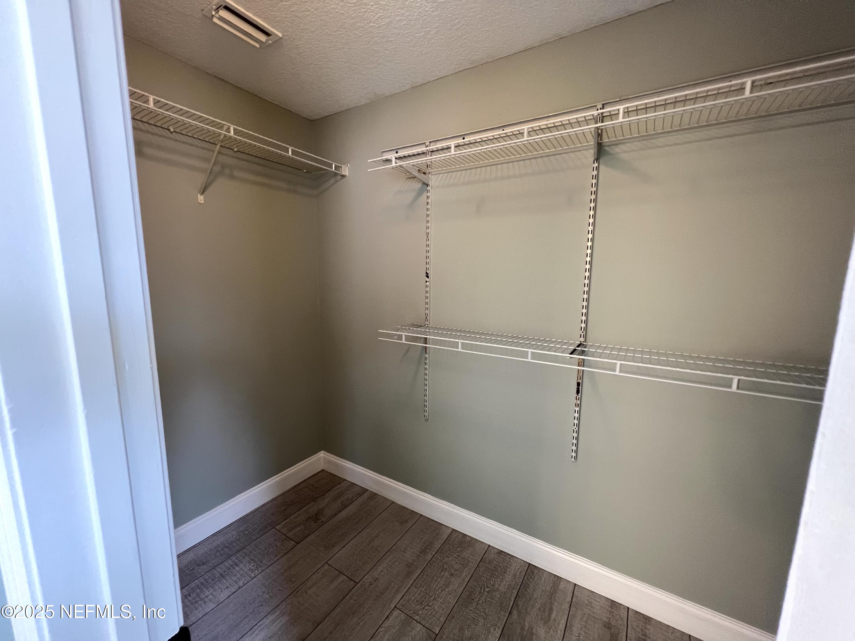 677 MacKenzie Circle St. Augustine, FL 32092 - Photo 83 of 92 a view of an empty walk in closet