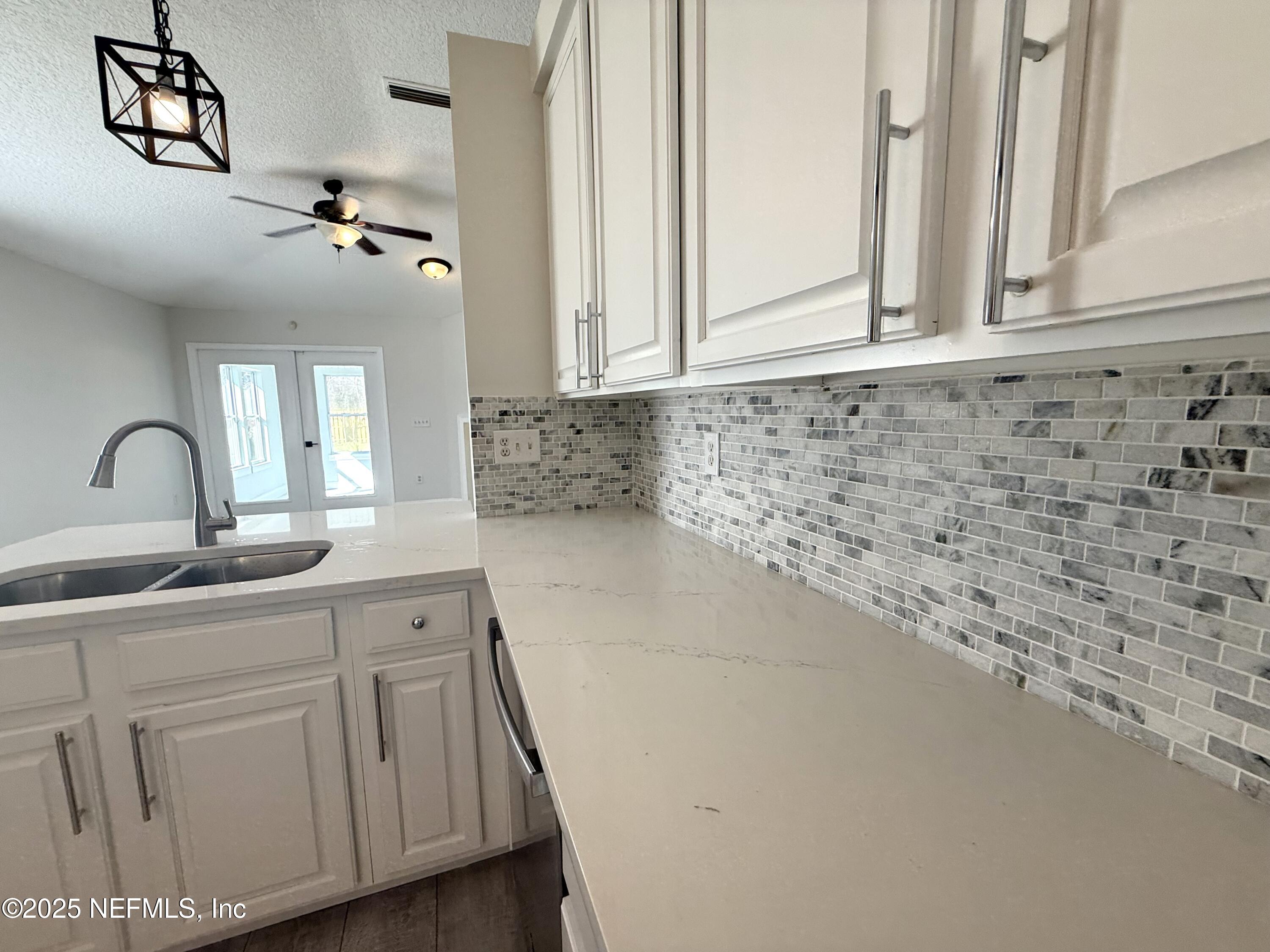 677 MacKenzie Circle St. Augustine, FL 32092 - Photo 10 of 92 a bathroom with a sink and a mirror