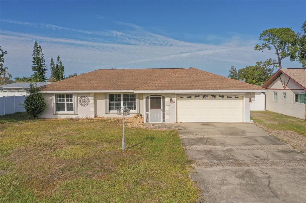 4202 Tangier Street Sebring, FL 33872 - Photo 1 of 29 a front view of a house with a garden and yard